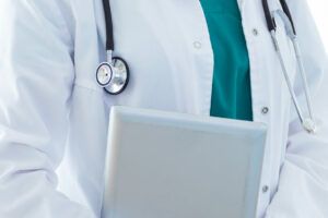 Beautiful young female doctor looking at camera in the office.